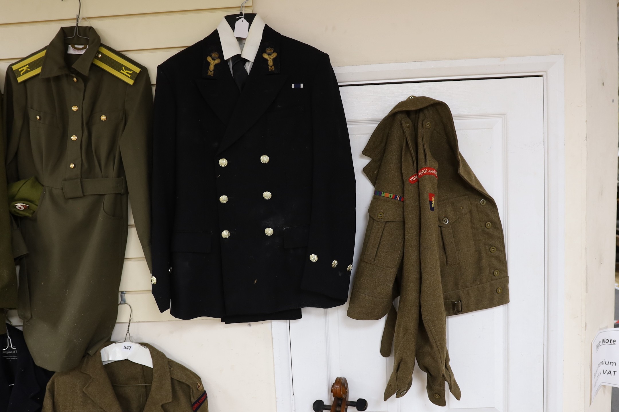 A collection of mixed Royal Navy and army military uniforms, including Royal Australian Corps of Signals (woman’s), Royal Artillery, Russian Army etc.